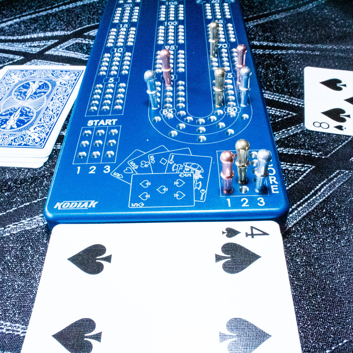 Blue Kodiak billet aluminum cribbage board with cards and metal pegs