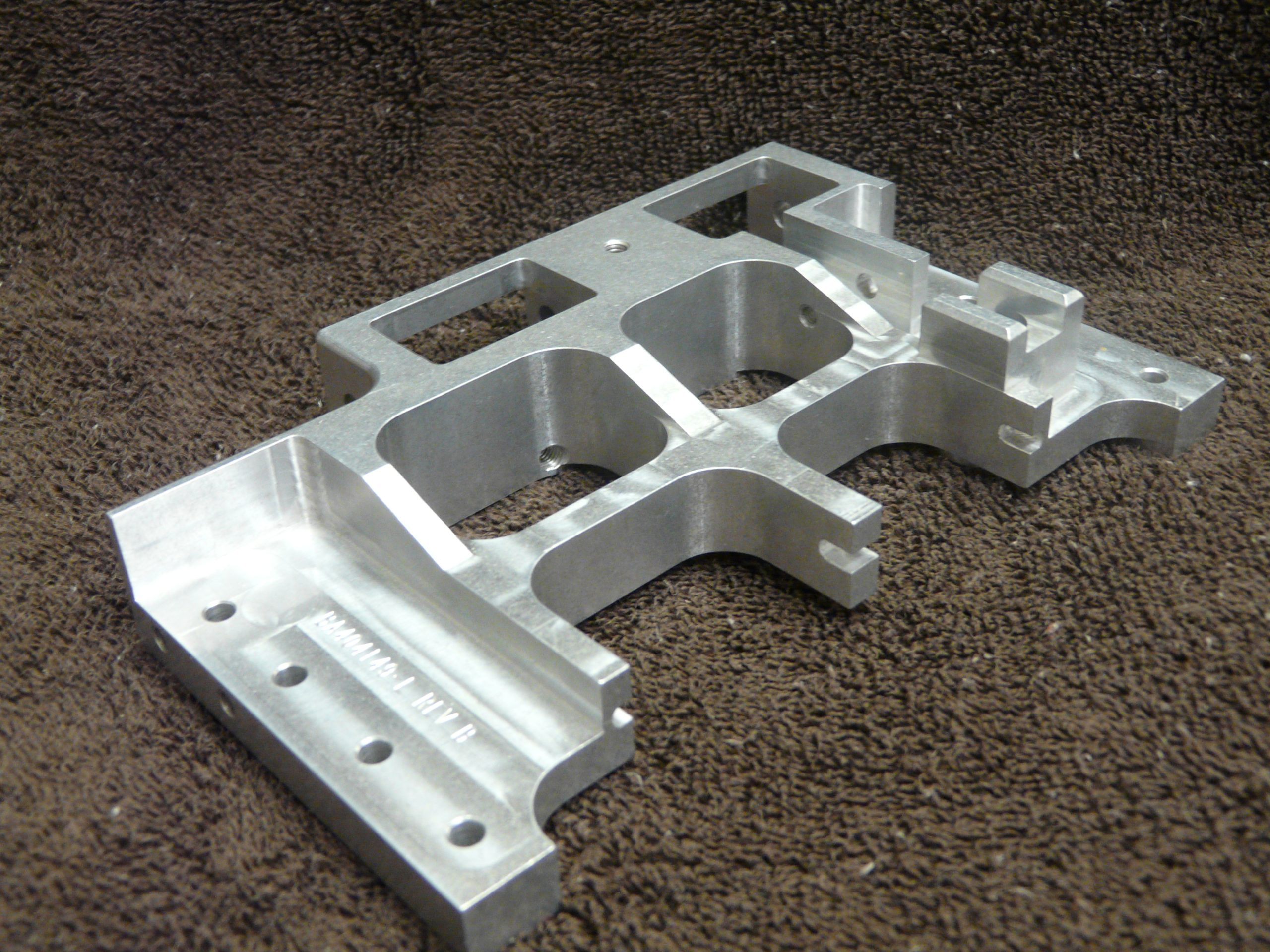 Complex machined aluminum bracket from Kodiak's public portfolio