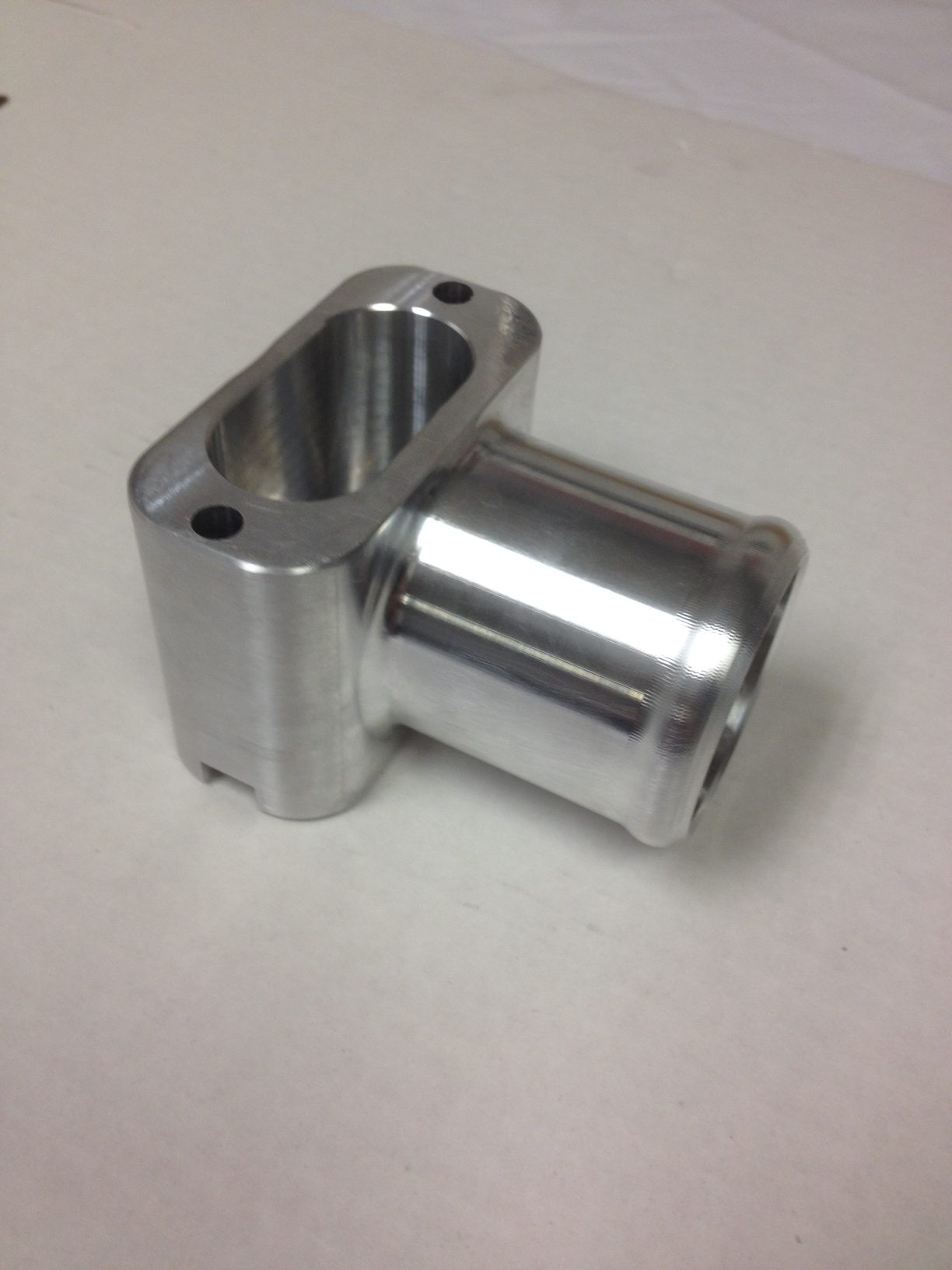 Close-tolerance machined aluminum component from Kodiak's public portfolio