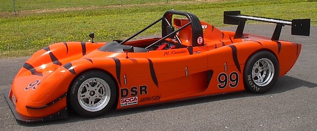 Orange sports racer fitted with Kodiak modular racing wheels